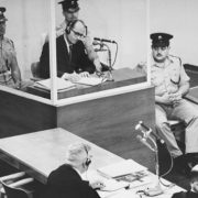 Adolf Eichmann takes notes during his trial USHMM 65268.jpg