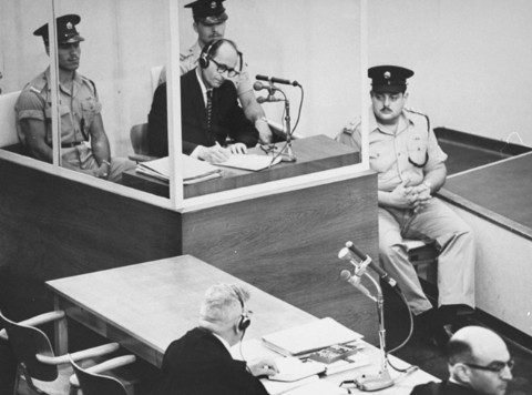 Adolf Eichmann takes notes during his trial USHMM 65268.jpg