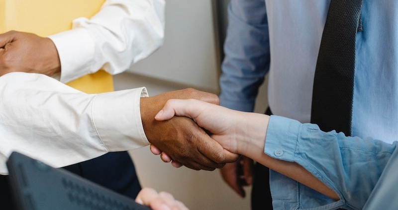 Photo by Sora Shimazaki from Pexels, https://www.pexels.com/photo/multiracial-colleagues-shaking-hands-at-work-5668838/
